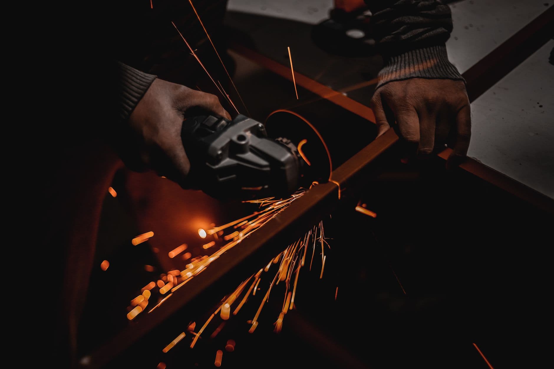 Construction worker using a hammer drill with vibration exposure risk