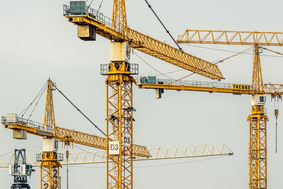 A mobile crane lifting materials on a construction site