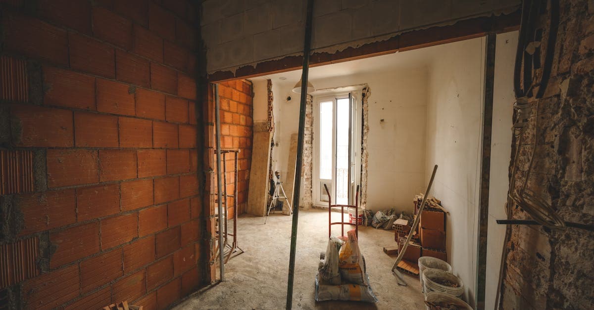A house undergoing major renovation work with scaffolding and building materials visible